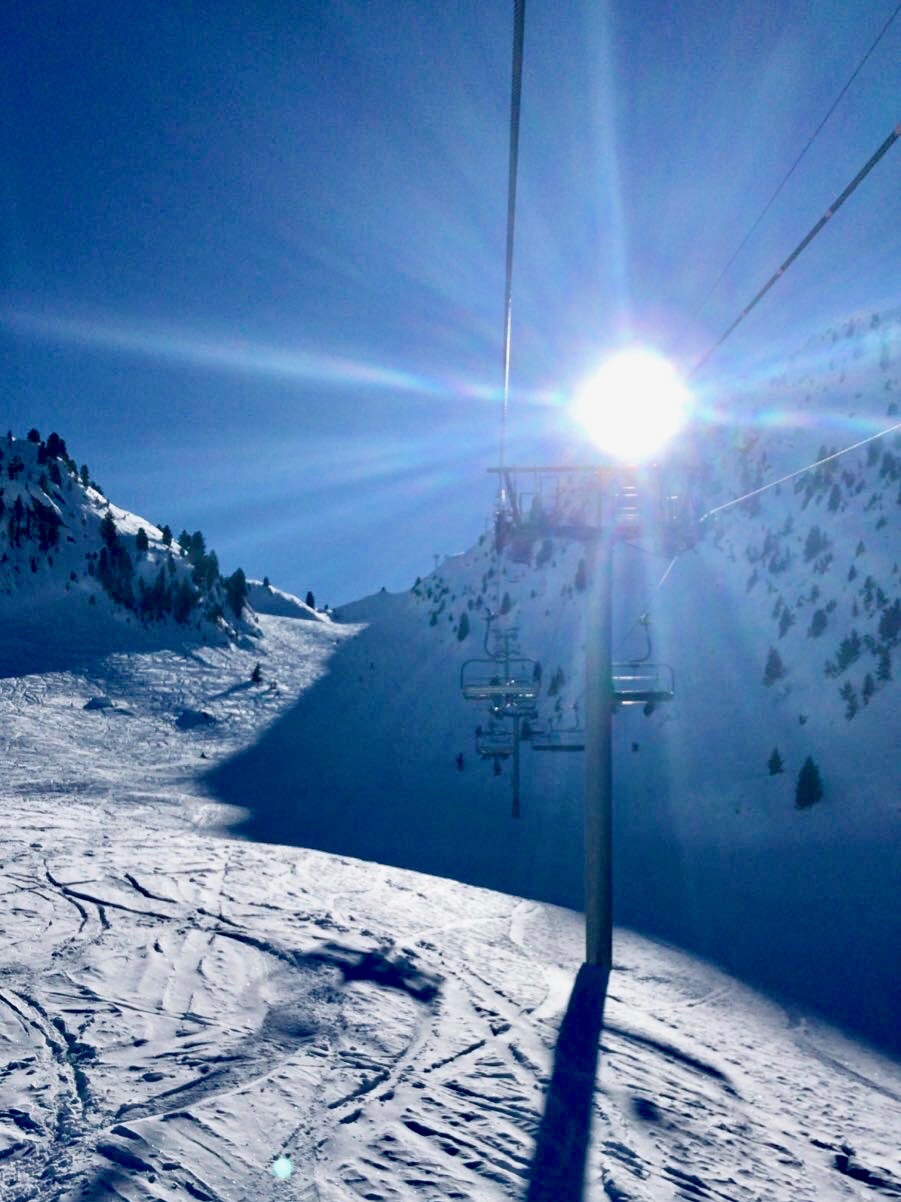 On a chair lift at the Méribel ski resort in the Tarentaise Valley of the French Alps