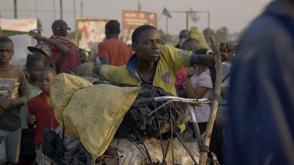 Kabwita Kasongo in Kolwezi with the remainder of his bags of charcoal to sell