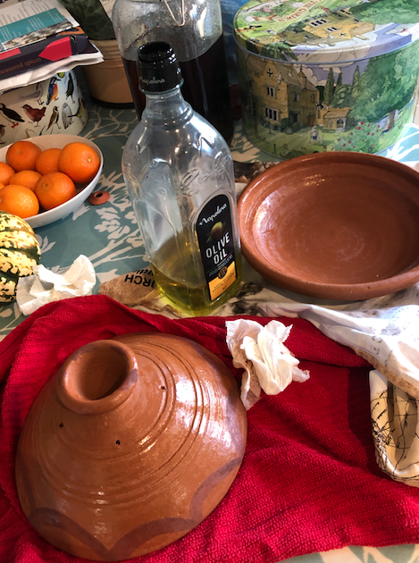 Rubbing olive oil into the tagine pot