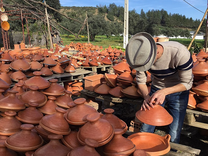 Stacks of clay tagine pots on display in Morocco