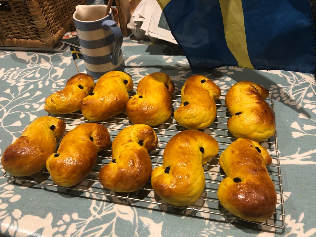 Ten freshly baked Lussebullar buns
