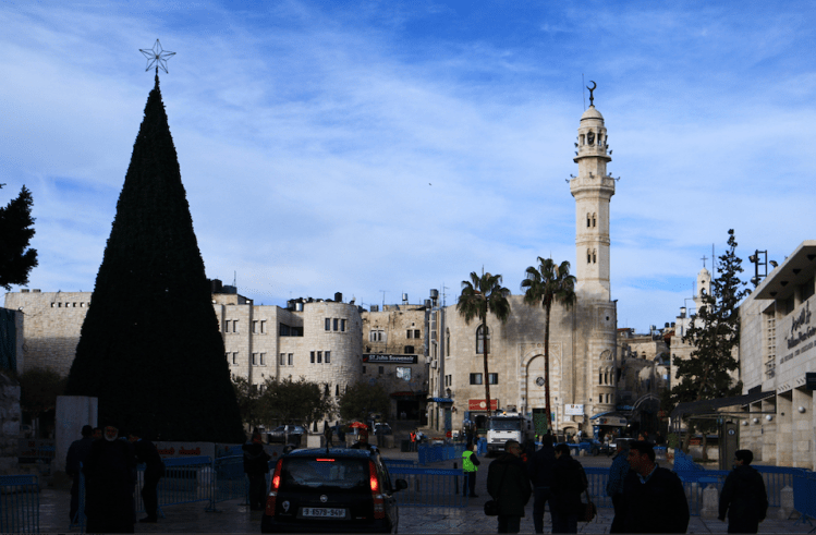 Manger Square in Bethlehem against a blue sky 