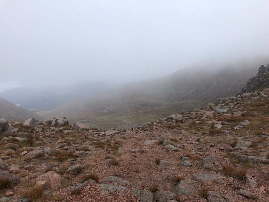 Near the mountain's edge, amidst a Mars-like rocky surface