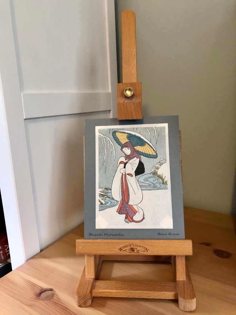 My Heron Maiden woodcut print on an easel