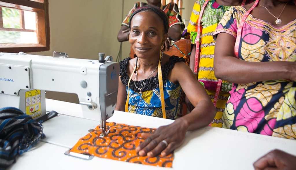 A woman at her sewing machine 